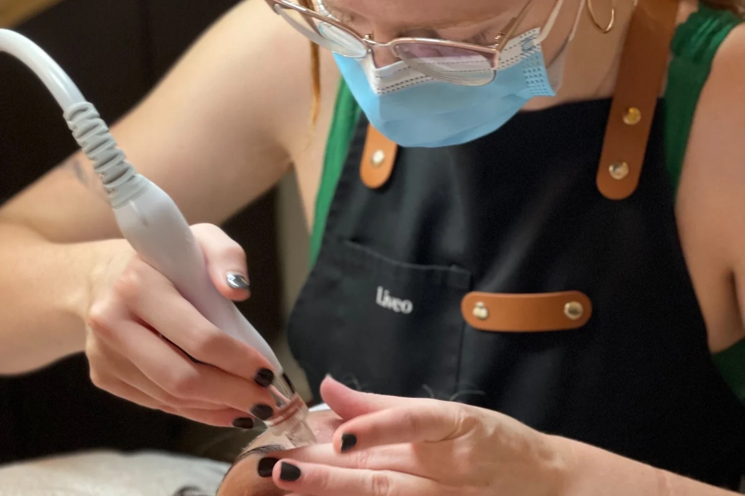 A Liveo artist teaching facial techniques